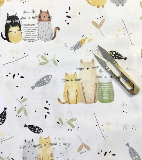 Bavlněná látka kočičí rodinka žlutá